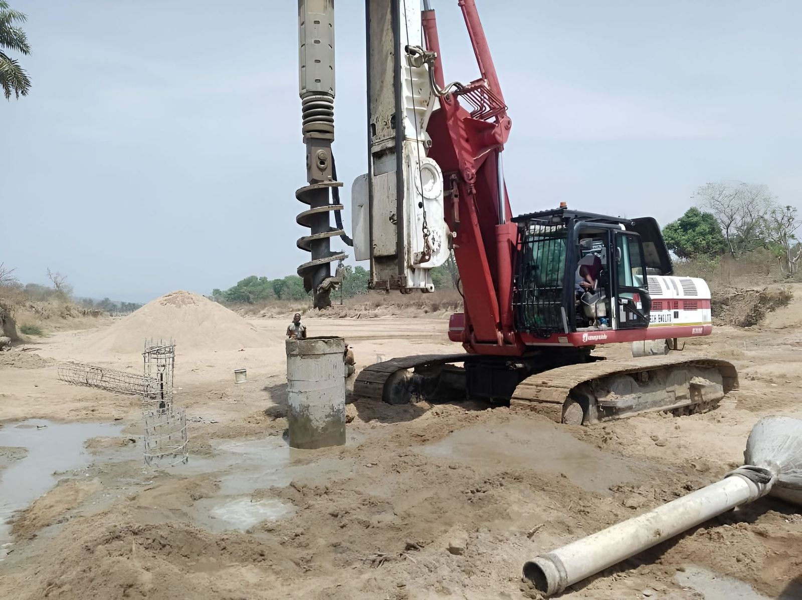 Rotary piling rig installing bored piles